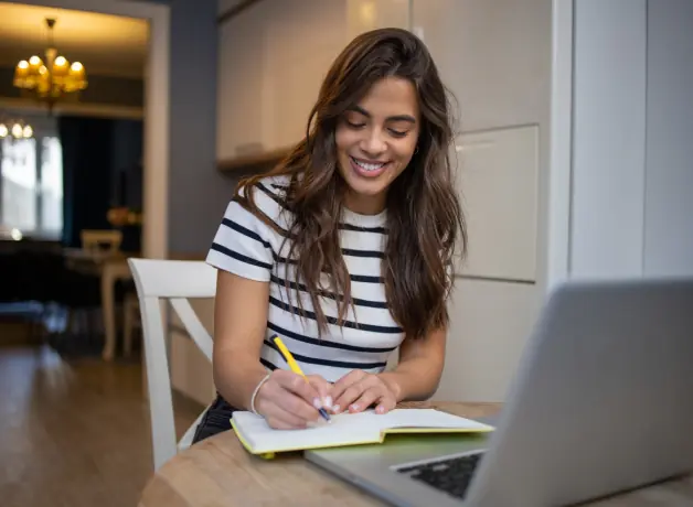 5 Habits of Successful Online Students Woman studying and taking notes
