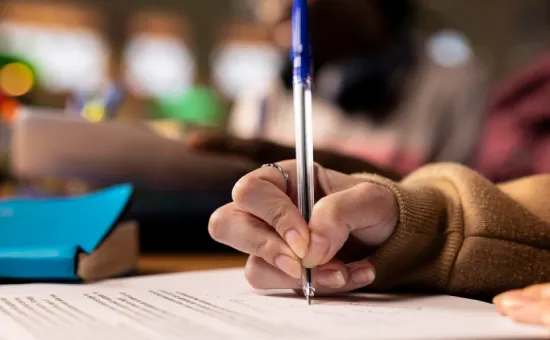 Ordinary Admission Exam Student writing